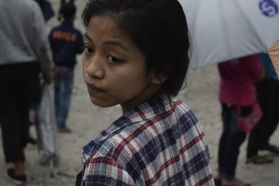 Close-up of young woman on street