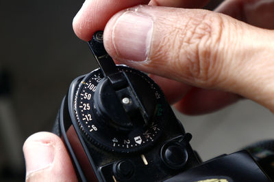 Close-up of person holding camera