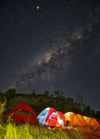 Scenic view of tent against sky at night