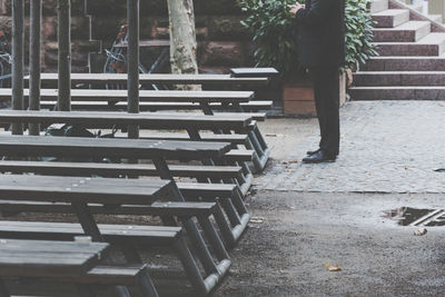 Empty bench on footpath