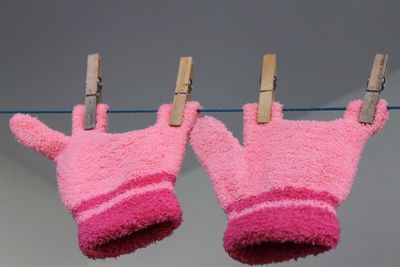 Close-up if gloves hanging on clothesline