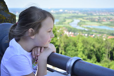 Close-up of girl looking at view of landscape