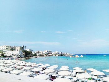 Scenic view of beach against blue sky