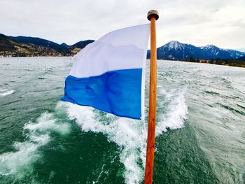 Flag on boat in sea