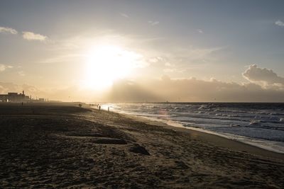 Scenic view of beach against sky during sunset