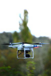 Octocopter flying against clear sky