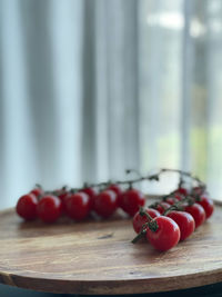Close-up of cherries on cutting board