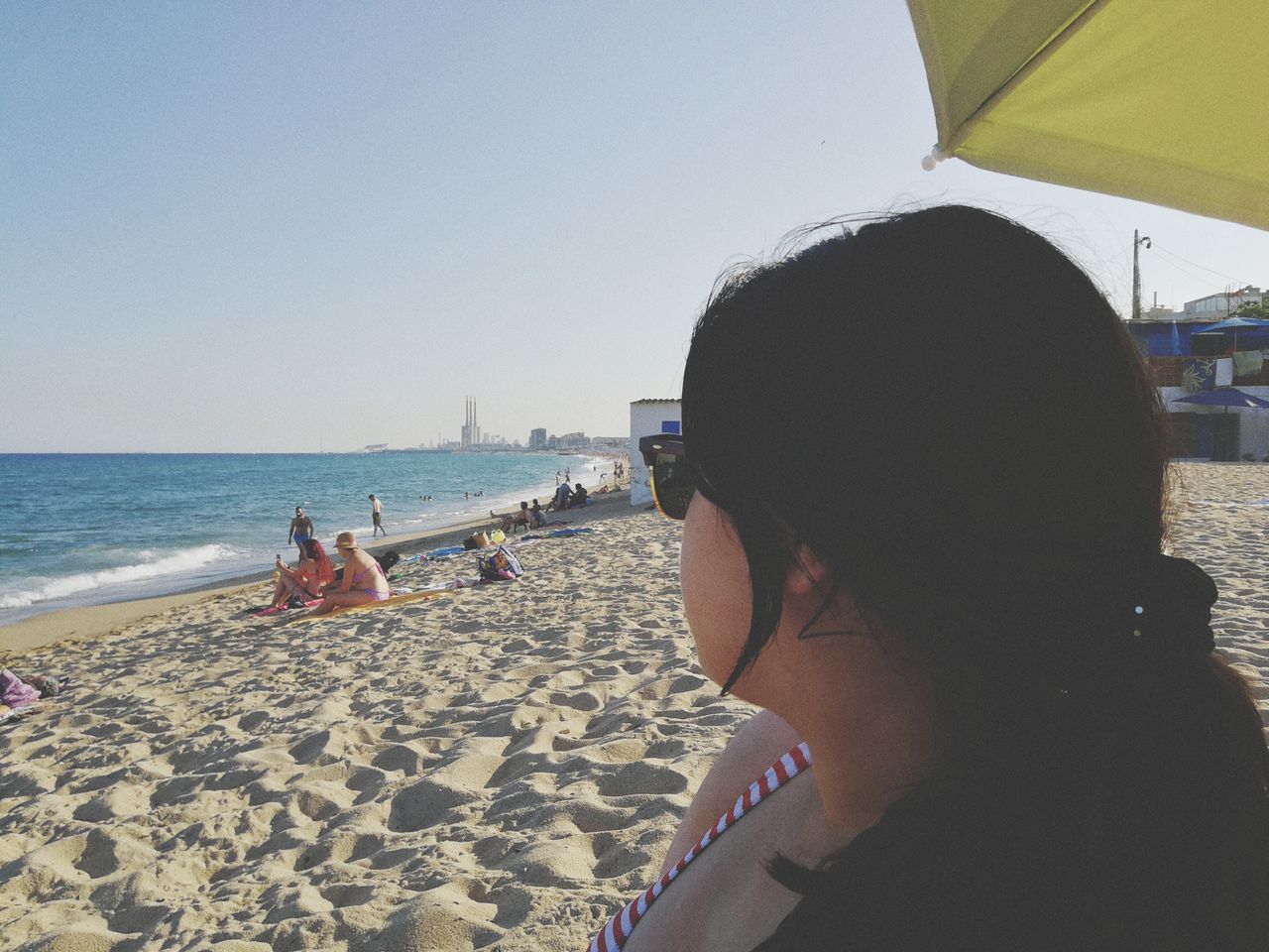 water, sea, sky, beach, land, real people, leisure activity, headshot, sand, lifestyles, nature, portrait, incidental people, women, people, adult, clear sky, day, outdoors, horizon over water