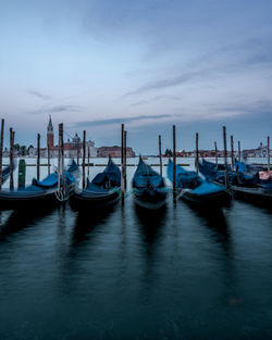 Boats moored in canal