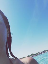 Silhouette of woman against clear blue sky