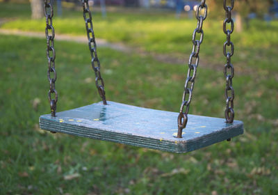 Close-up of swing in playground