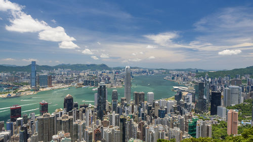 High angle view of cityscape against cloudy sky