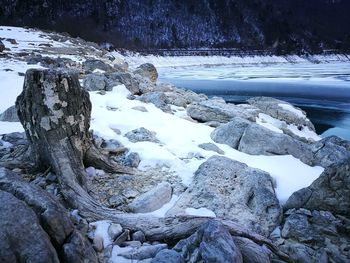 Close-up of frozen landscape against sky