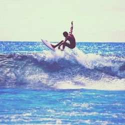 People surfing in sea