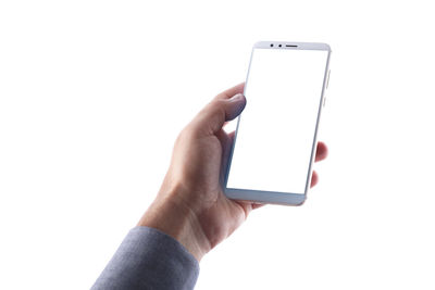 Midsection of person using smart phone against white background