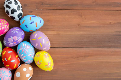 High angle view of multi colored eggs on table