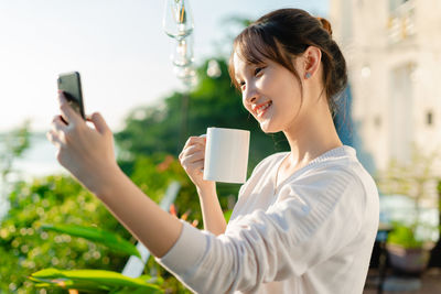 Young woman drinking glass