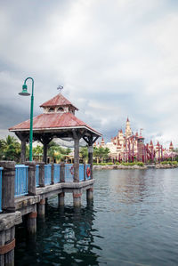 View of pier in city against sky