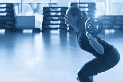 Low angle view of man standing in gym