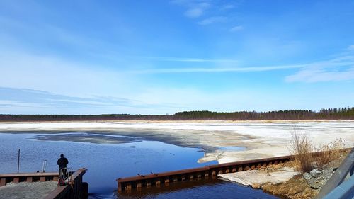 Scenic view of lake against blue sky