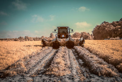 Field against cloudy sky