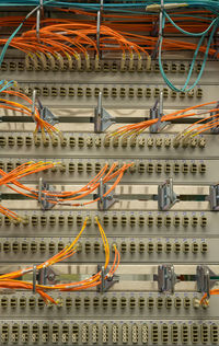 Led lights in a server rack with rj45 and fiber optic cable connectors in a data center