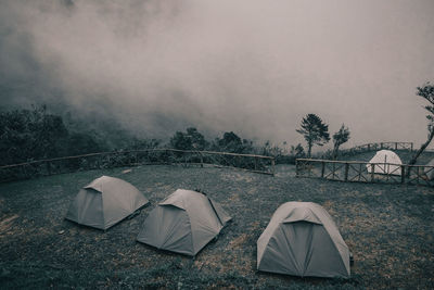 Tent on field against sky