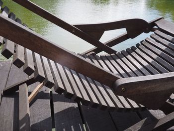 High angle view of chairs on wood