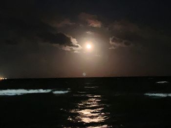 Scenic view of sea against sky at night