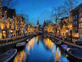 View of canal in city at night