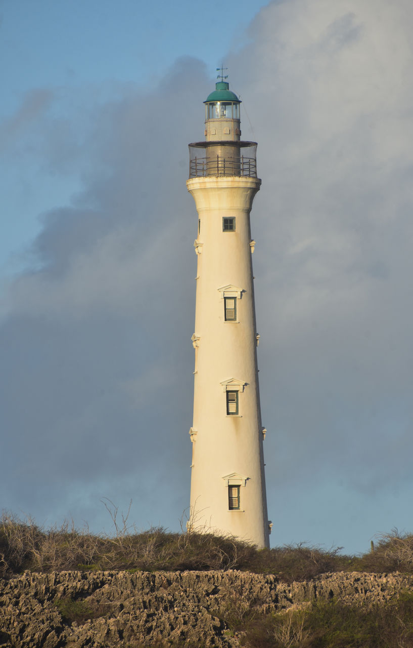 guidance, lighthouse, tower, architecture, built structure, building exterior, security, protection, building, sky, nature, cloud, observation tower, no people, land, day, travel destinations, travel, beach, low angle view, outdoors, water, sea, history, assistance, the past, surveillance, house, communication