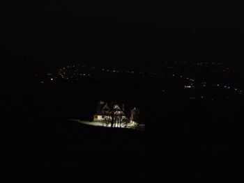 Distant view of illuminated city at night