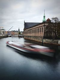 View of bridge over river in city