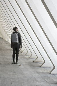 Full length of man standing on footpath