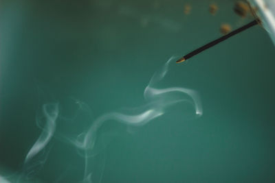 Close-up of smoke emitting from water