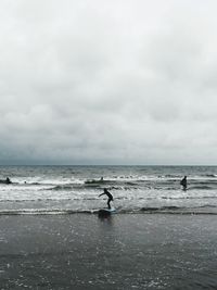 Scenic view of sea against cloudy sky