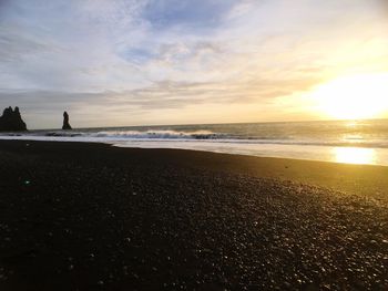 Scenic view of sea against sky at sunset