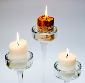 Close-up of tea light candles on table