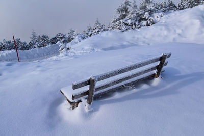 Scenic view of snow covered field against mountain