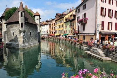 Reflection of buildings on water in canal