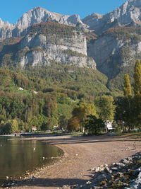 Scenic view of lake by mountains