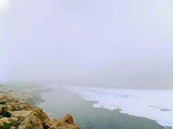 Scenic view of mountains against sky during winter