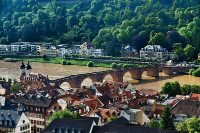 High angle view of arch bridge amidst buildings in town