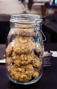Close-up of bread in glass jar on table