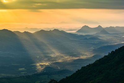 Scenic view of mountains against sky during sunset