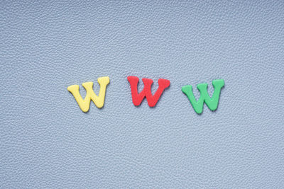 High angle view of colorful w letter on table