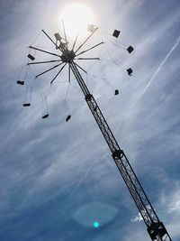 Low angle view of ferris wheel against sky