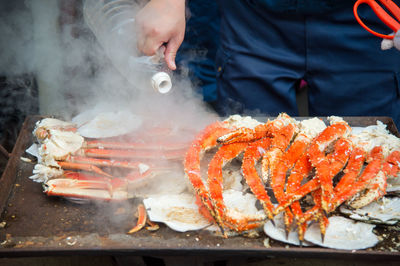 Midsection of man preparing food