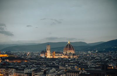 The cathedral, illuminated by city lights, ideal for travel and cultural projects.