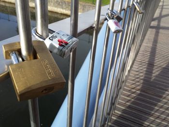 Close-up of padlocks on railing